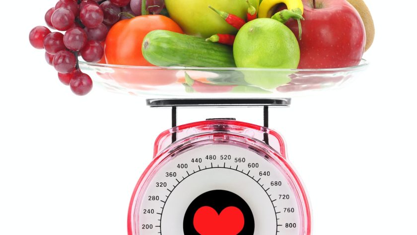 Healthy eating. Kitchen scale with fruits and vegetables