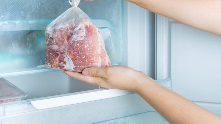 Taking frozen meat from the modern no-frost freezer